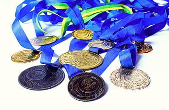 Tournament medals laid out on a white table