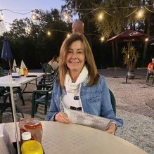 A photo of the Pembroke Pickle Ball Club's president Sandra on a restaurant patio