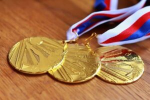 Three medals laid out on a table